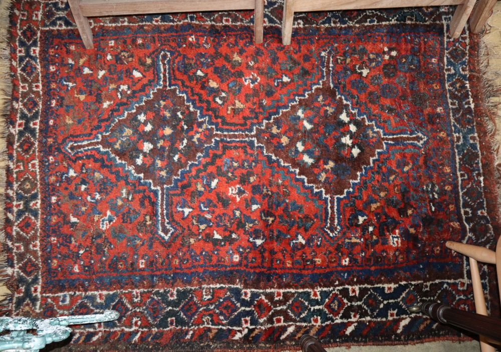 A Qashqai red ground rug, 140 x 110cm